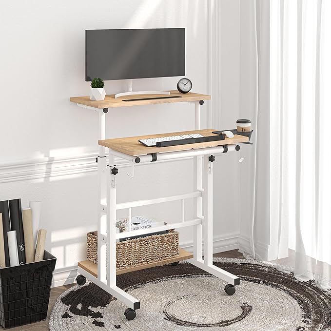 Klvied Mobile Standing Desk with Storage Bottom Shelf, Portable Stand Up Desk with Cup Holder, Adjustable Height Small Standing Desk, Rolling Desk with Wheels, Home Office Laptop Cart, Khaki